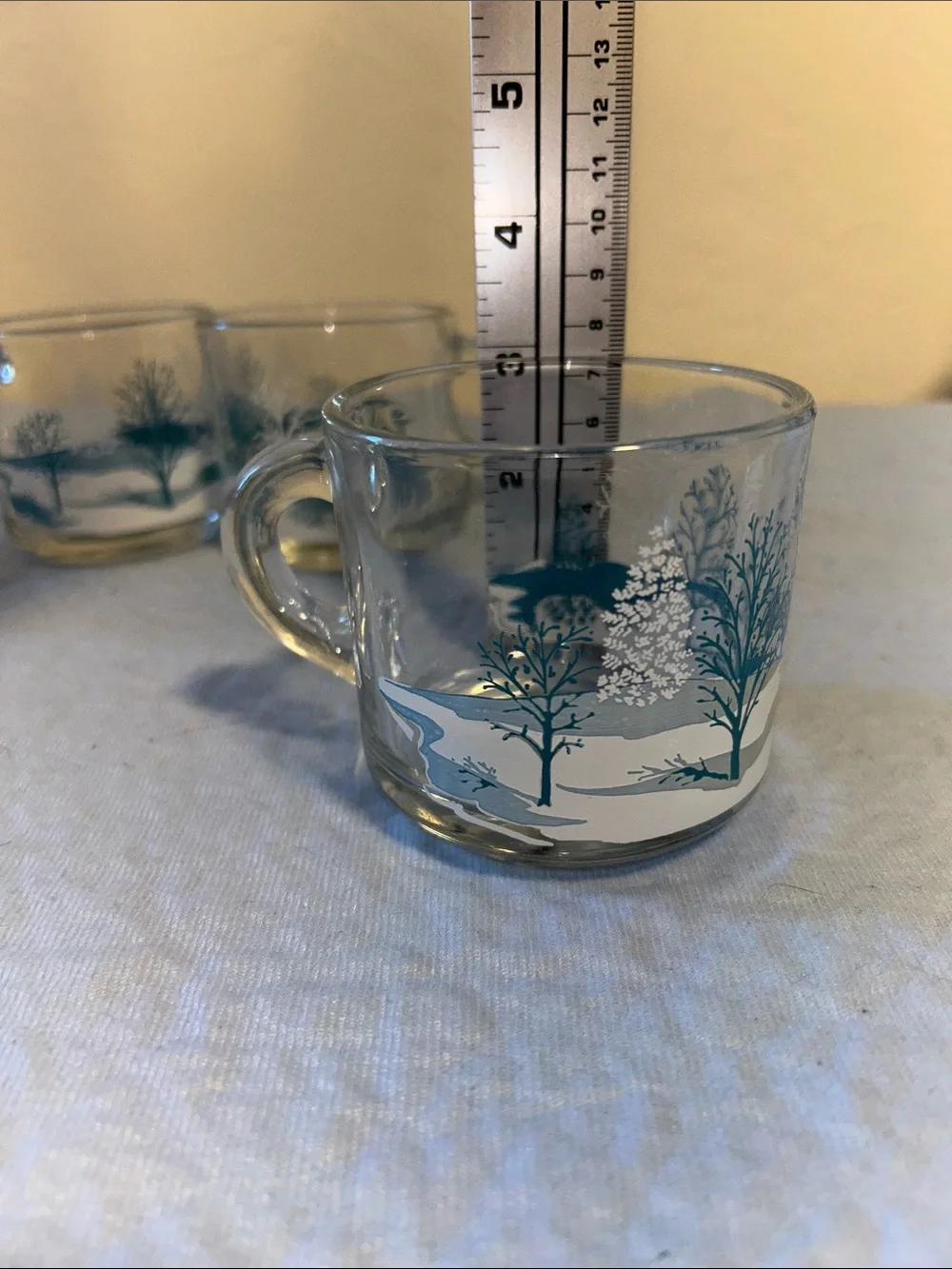Set of 4Anchor Hocking clear glass coffee mugs featuring a blue-and-white winter